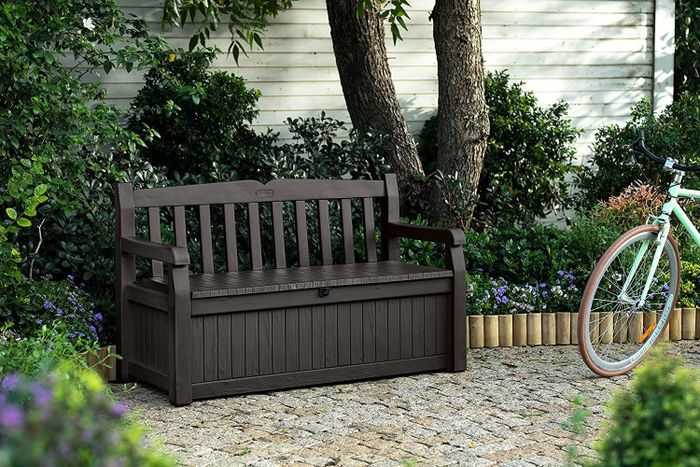a deep brown bench with a hidden storage box