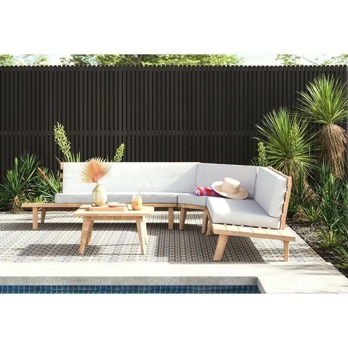 Right-hand-facing outdoor sofa positioned around a pool.