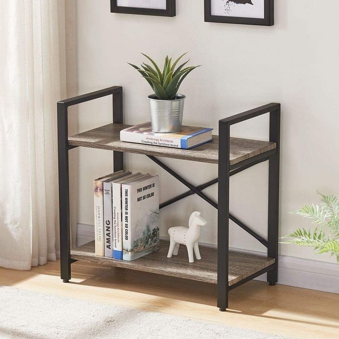 The two-tier industrial bookshelf showcasing books and decor