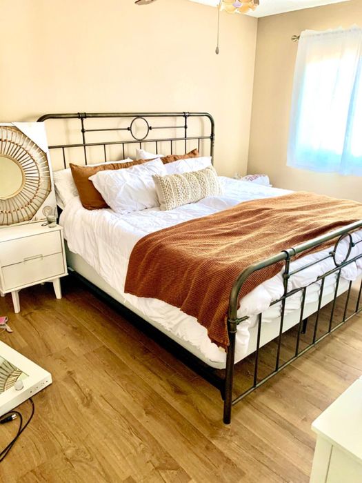 bronze-toned bed frame in a reviewer's bedroom