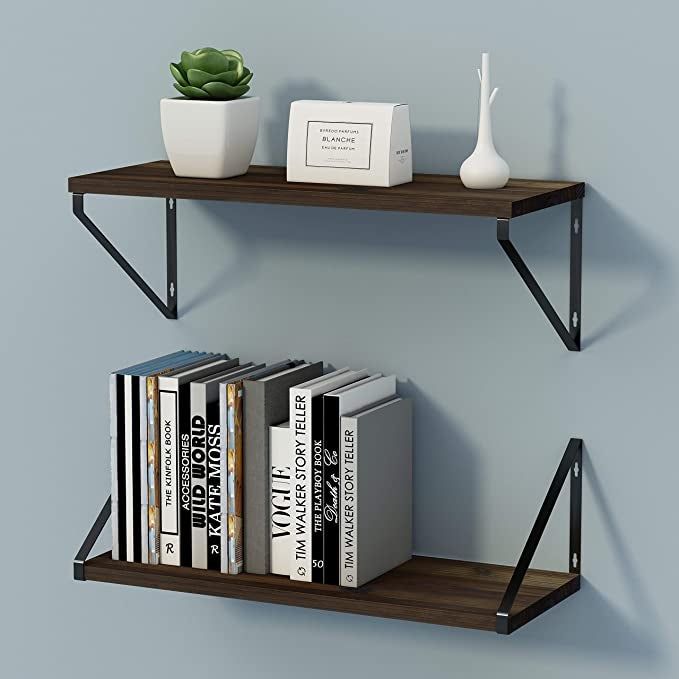A set of two industrial floating shelves mounted on a wall