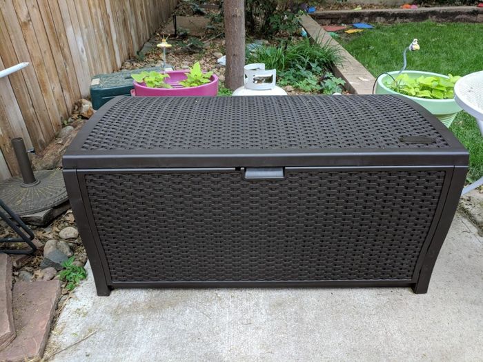 the brown wicker storage bin