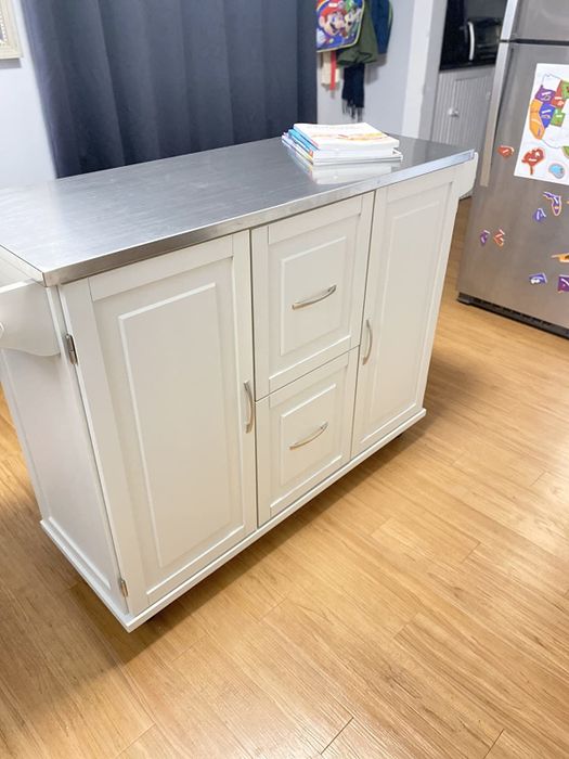 white cart featuring a stainless steel top
