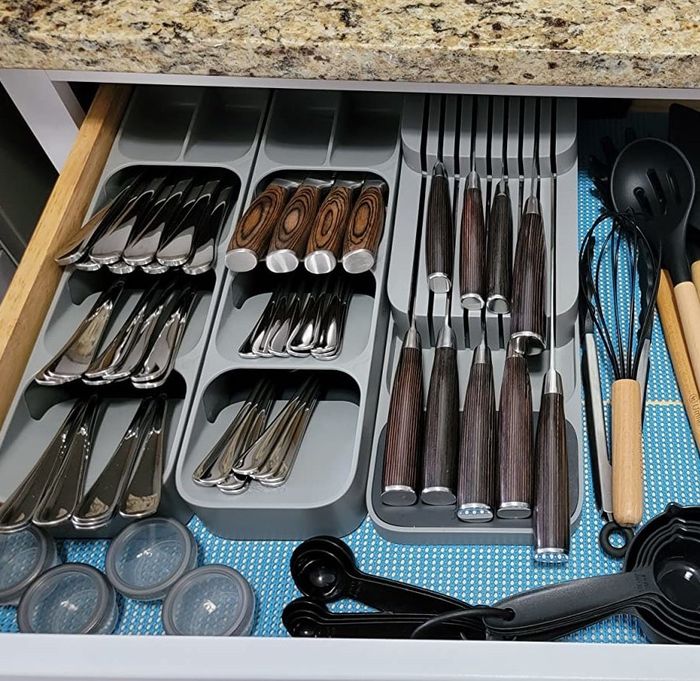 A reviewer demonstrates three organizers neatly arranged in their drawer