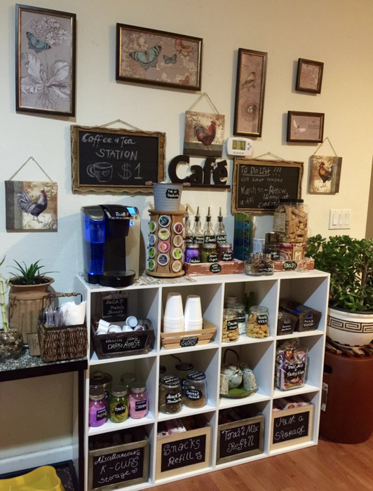 A reviewer's cube shelves used to organize a coffee and snack station