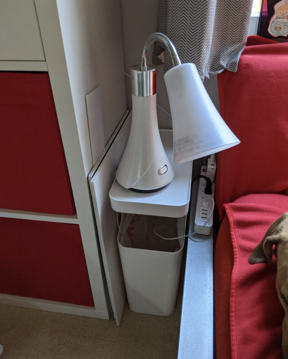 A reviewer's trash can disguised as an end table