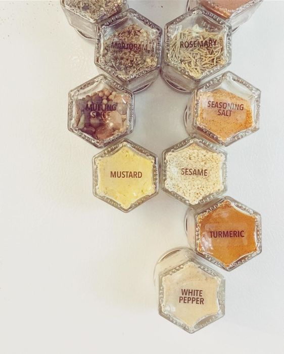 The same reviewer gives a close-up view of the jars, each labeled for quick identification.