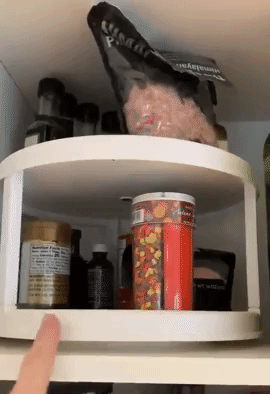 A gif showing a reviewer spinning a turntable filled with spices, making it easy to access them.