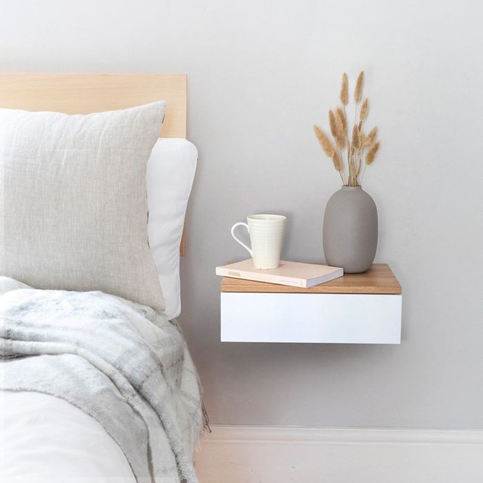 Floating bedside drawer in a bedroom setting