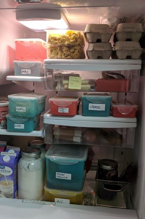 A reviewer displays their fridge, neatly organized with labeled items.