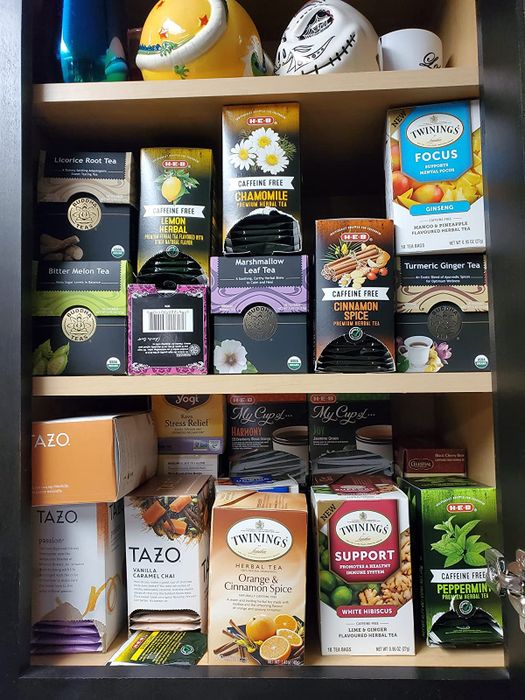 A reviewer's cabinet filled with assorted tea boxes