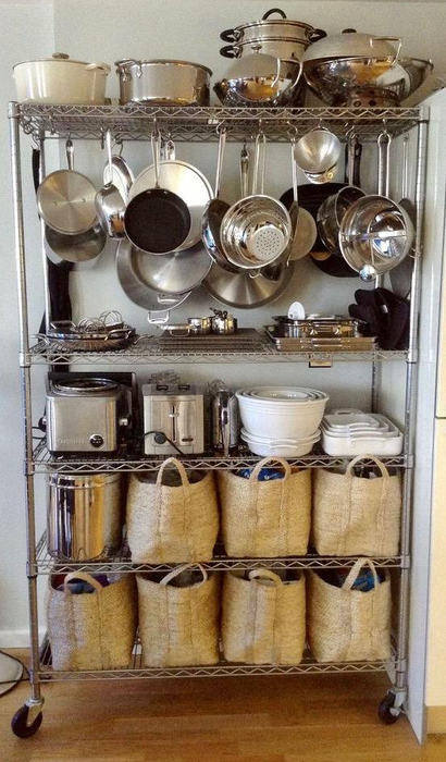 A reviewer organizes their pans on the shelving unit for convenient storage.