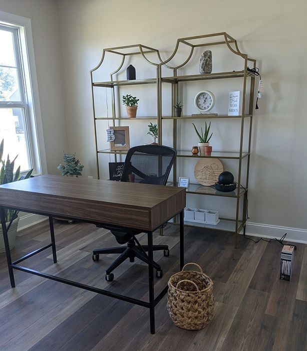two of the bookcases positioned behind a reviewer's desk