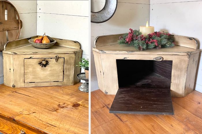A small wooden corner cabinet placed on a kitchen counter