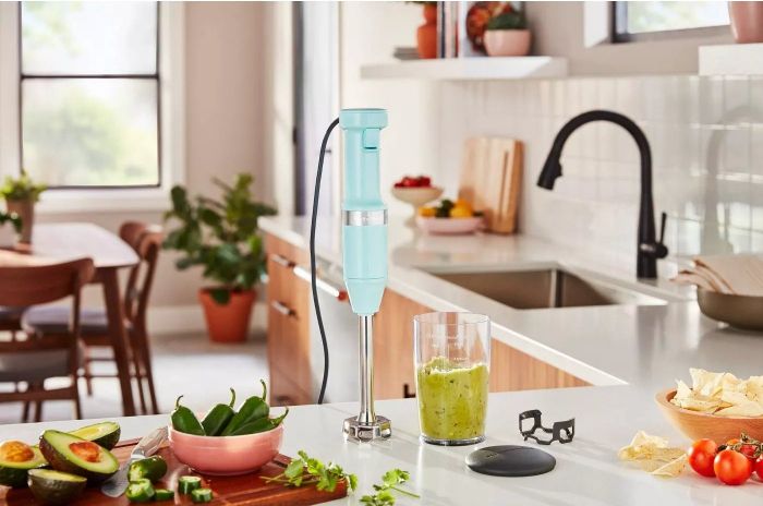 The hand blender in action, mixing ingredients for guacamole with ease.