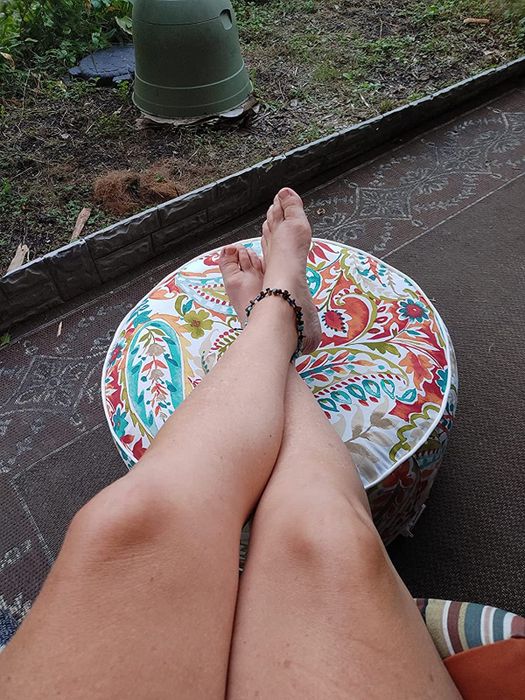The same reviewer relaxing with feet on the ottoman.