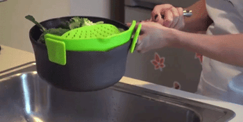 Gif showing the use of the colander to strain water from a pot it’s attached to