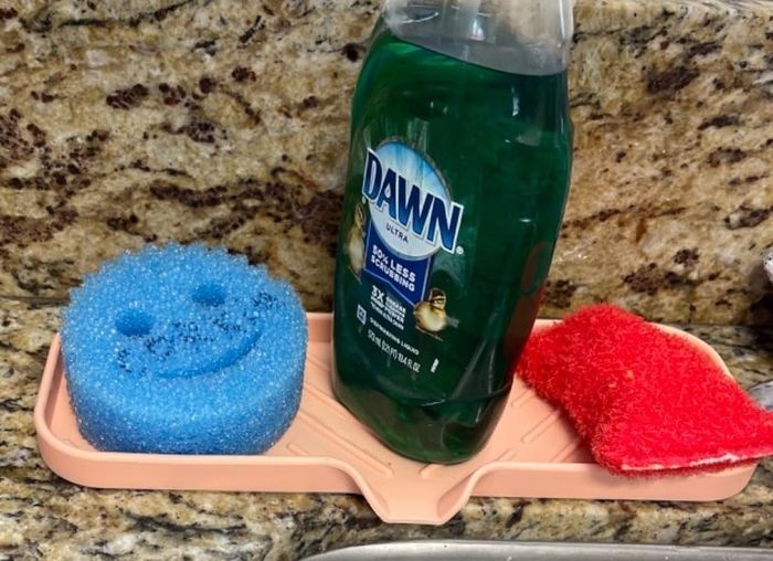 A Scrub Daddy sponge placed beside a sink