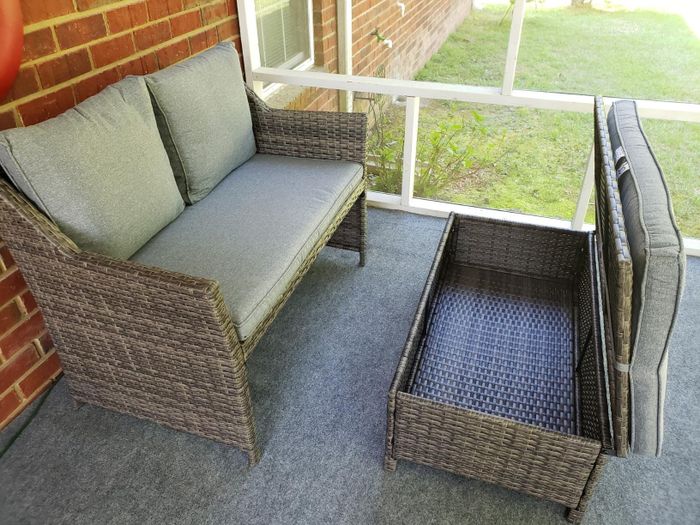Another reviewer's coffee table top is lifted, showcasing the convenient hidden storage inside.