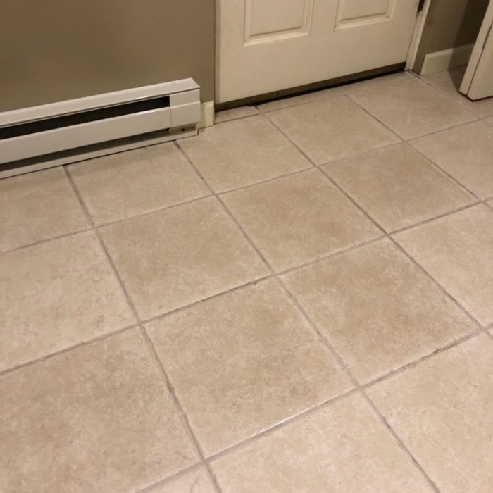A reviewer’s photo of a tiled floor after using grout cleaner