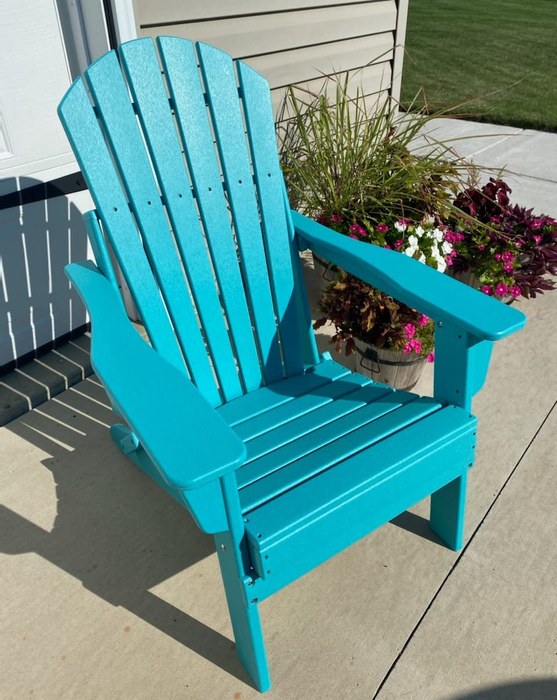 Another reviewer's teal Adirondack chair set up outside.