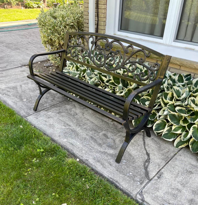 A reviewer’s garden bench placed in their outdoor space.