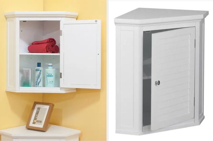 A compact white wall-mounted corner cabinet placed against a vibrant yellow wall