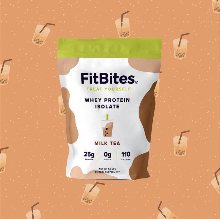 FitBites Whey Protein Isolate in Milk Tea flavor is showcased with a backdrop of milk tea illustrations, featuring packaging that highlights 25g of protein, 0g sugar, and 110 calories