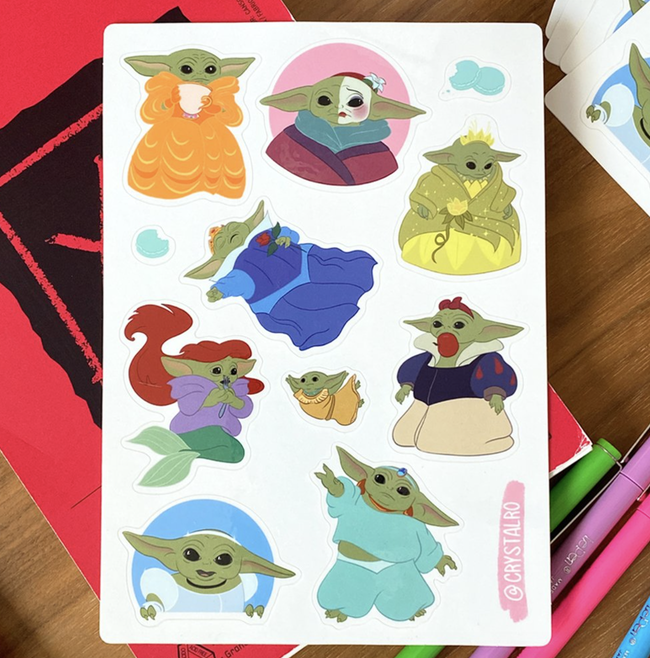 A sticker sheet featuring Baby Yoda transformed into various Disney Princesses