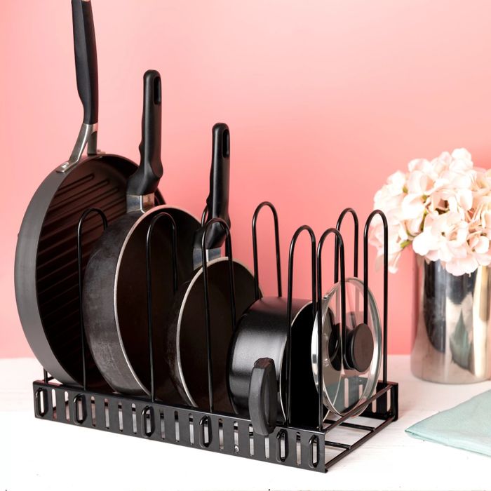 The pot rack positioned horizontally on a kitchen counter.