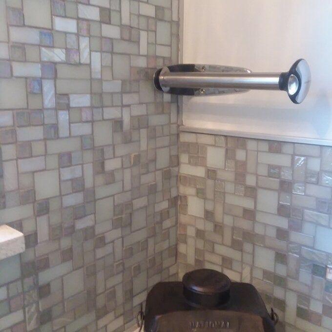 An empty towel rack mounted on the wall.