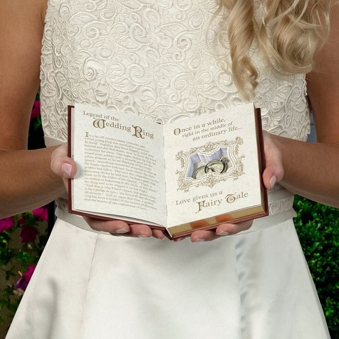 The inside of the book with a reading about fairy tales and a cut-out section to store rings safely