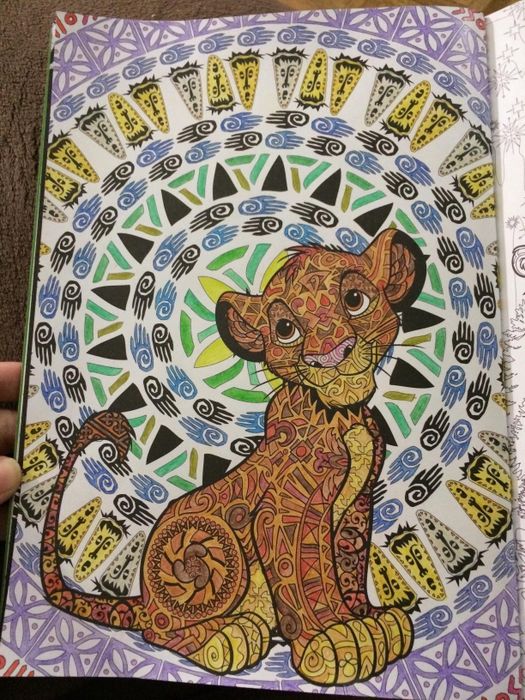 a reviewer's colored-in Disney coloring book page featuring Simba
