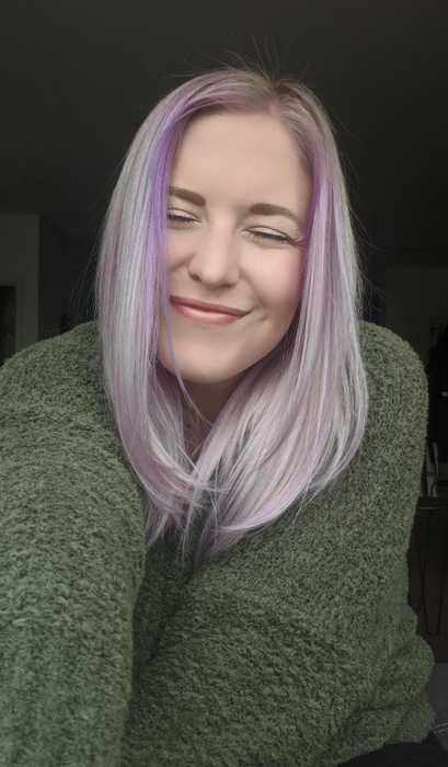 A customer review photo showing their hair after using Keracolor Clenditioner in purple.