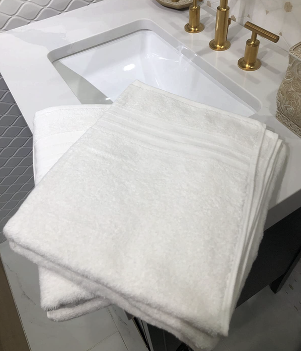 A customer review photo of their towels neatly folded and fluffy