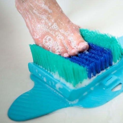 A foot using the scrubber for a soothing experience