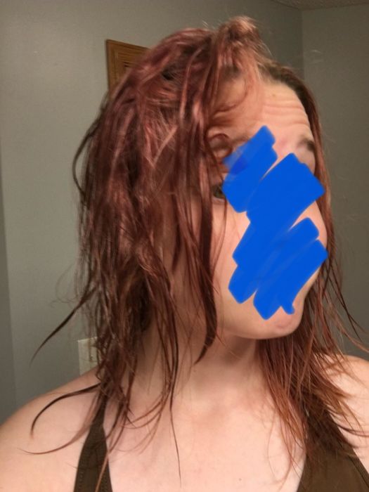 A customer's photo showing their tangled hair before using the Wet Brush