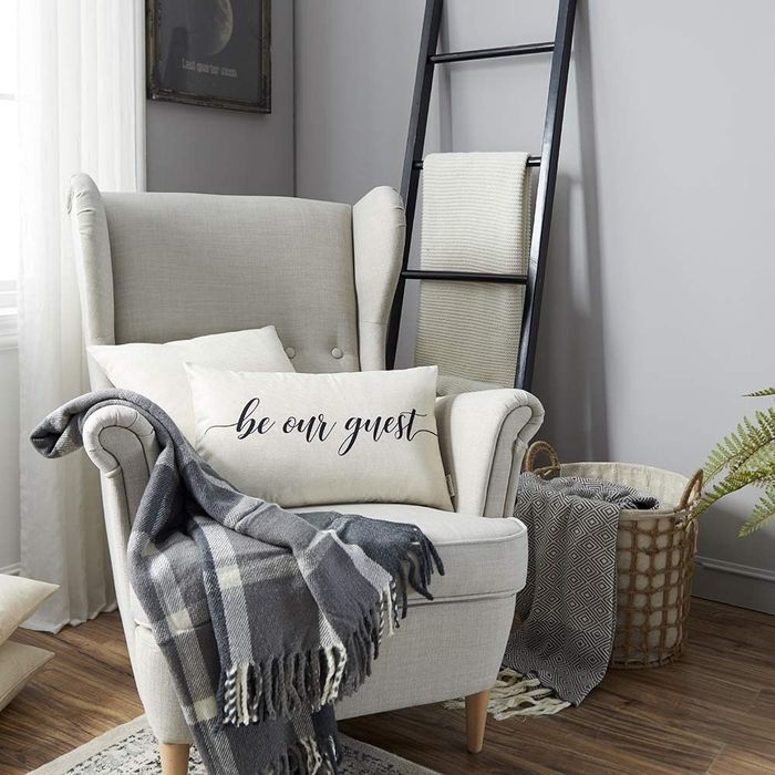 An off-white throw pillow with