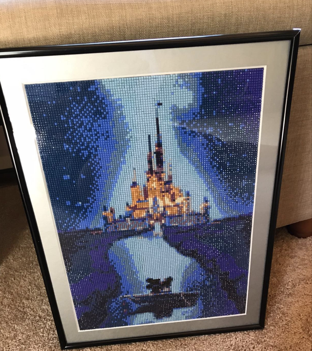 A photo of the completed rhinestone artwork showcasing the intricate details