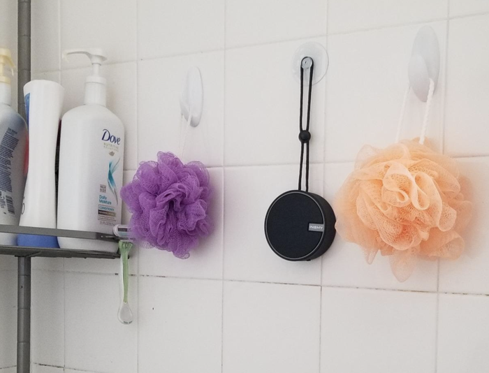 A customer review photo showing their speaker inside the shower