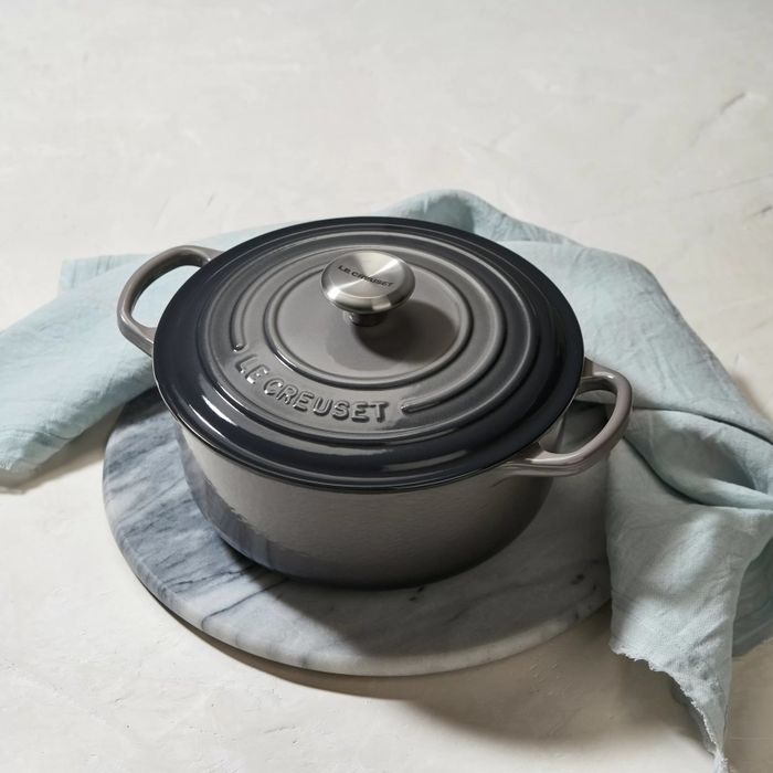 The Le Creuset Dutch oven with handles on both sides and a coordinating lid.