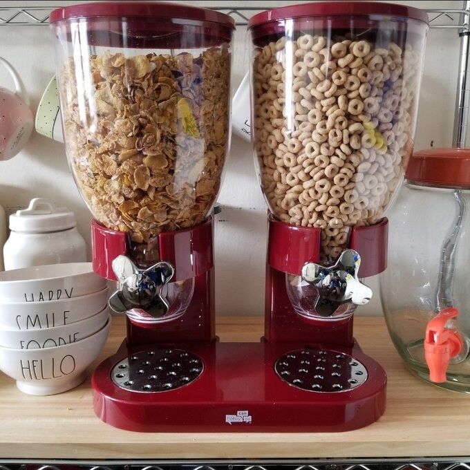 The cereal dispensers displayed in a kitchen.