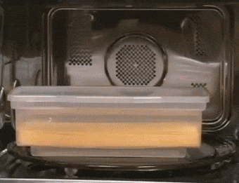 A gif showing the simple steps to use the microwave pasta cooker.
