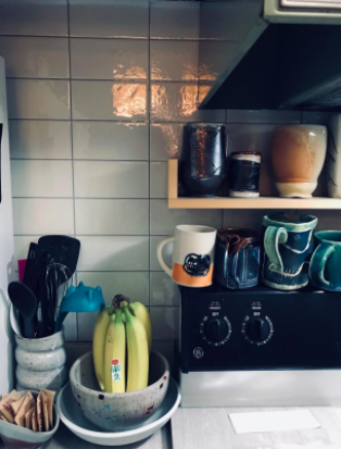 Another reviewer's picture of the backsplash tiles arranged in a stacked subway pattern