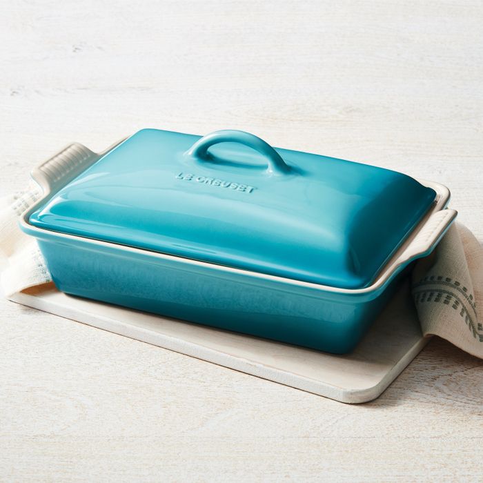 The Le Creuset casserole dish accompanied by a matching lid, ready for a delicious meal.