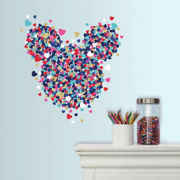 A vibrant, glittery Mickey Mouse wall decal made up of tiny colorful hearts