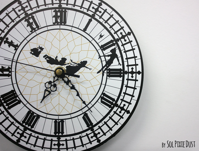A Big Ben wall clock adorned with decals of Peter Pan and his crew soaring across it