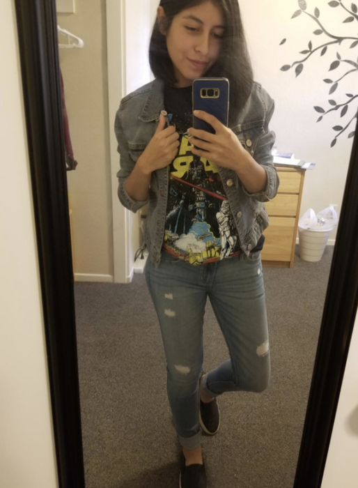 a reviewer rocking a Star Wars graphic tee under a denim jacket