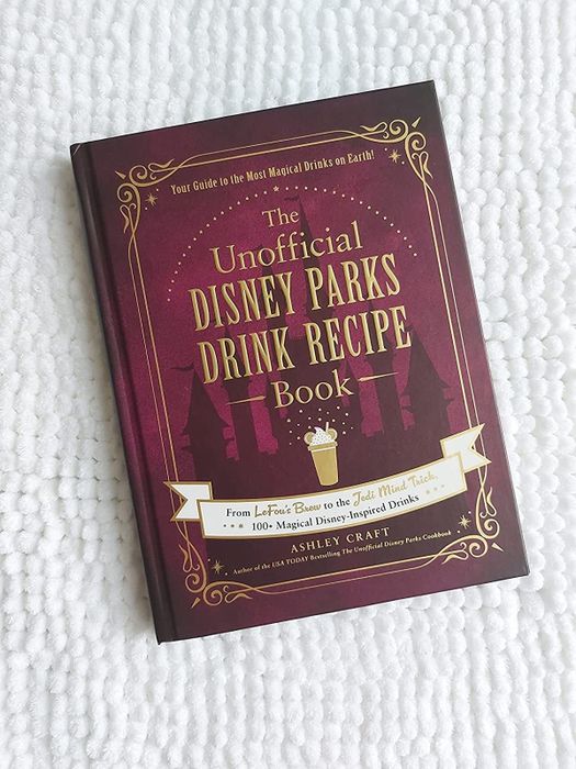 the burgundy cover of The Unofficial Disney Parks Drink Recipe book