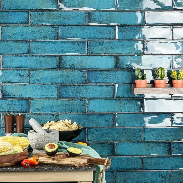 The blue ceramic subway tiles displayed in a kitchen setting.